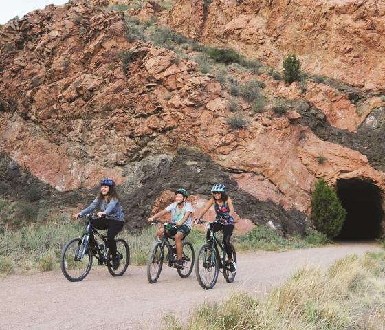 kids biking near tunnel