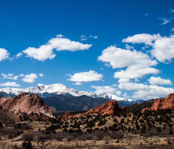 Garden of the Gods with snow on Pikes Peak in the background.
